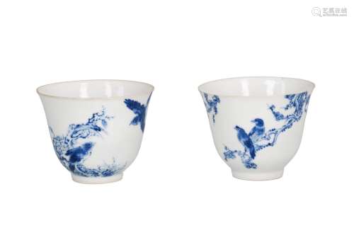 A lot of two blue and white eggshell porcelain cups, decorated with birds in a tree in the style