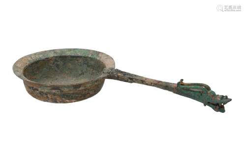 A bronze iron implement, decorated with a dragon on the handle. China, Han, 206 BC - AD 220 or