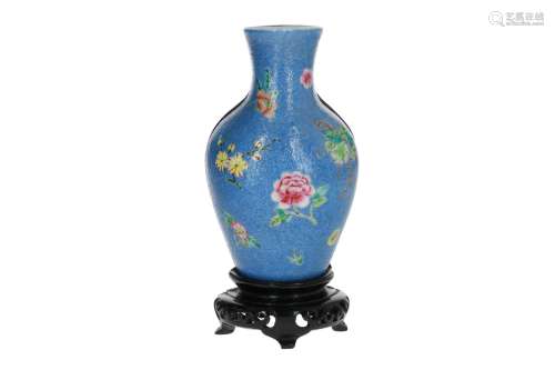 A polychrome sgraffiato porcelain wall vase on wooden base, decorated with flowers. Unmarked. China,