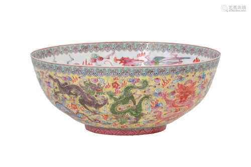 A polychrome eggshell porcelain bowl. The outer side decorated with dragons, the inside with phoenix
