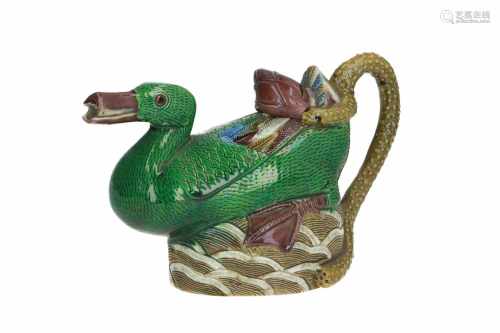An emaille sur biscuit porcelain water ewer in the shape of a duck sitting on a rock. The handle