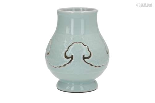 A two-piece celadon vase with underglaze decor in relief. Marked with seal mark Qianlong. China,