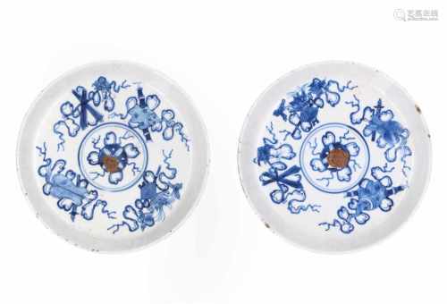 Lot of two blue and white porcelain dishes, decorated with antiquities. Both marked with 4-character