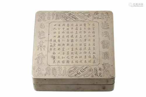 A red and yellow copper ink box, decorated with engraved text about life. China, 20th century.