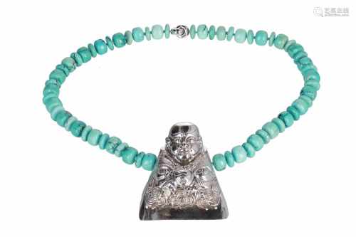 A turquoise bead necklace, with a silver center pendant, and 18-kt gold clasp by Steltman, Den