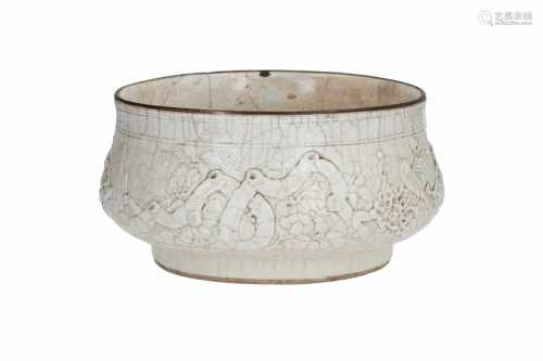 A blanc de Chine porcelain bowl, decorated in relief with birds and flowers. Unmarked. China, 19th