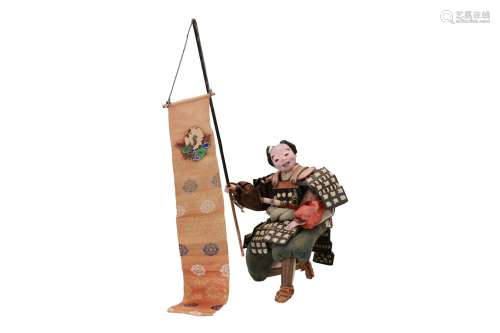 A doll of a Japanese kneeling samurai warrior with a stick. Japan, 19th/20th century. H. excl. stick