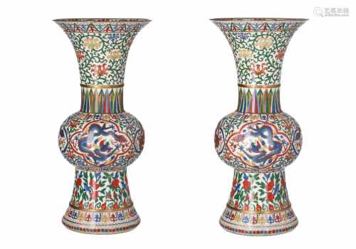 A pair of polychrome cloisonné vases, decorated with flowers, birds and dragons. Unmarked. China,