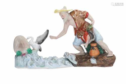 A lot of two polychrome porcelain sculptures, 1) fisherman with two fish. H. 22 cm. 2) crane in