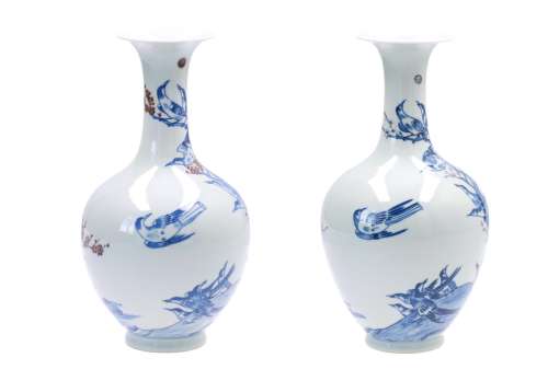 A 'near-pair' of polychrome porcelain vases, decorated with birds in a tree. Marked with seal mark