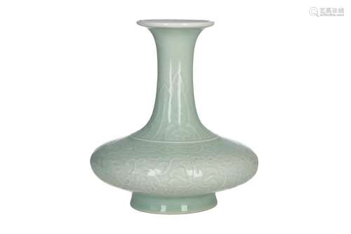 A celadon glazed porcelain vase, decorated with flowers in relief. Unmarked. China, 20th century. H.