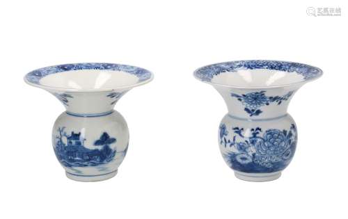 A 'near-pair' of blue and white porcelain spittoons, decorated with a river landscape and peonies.