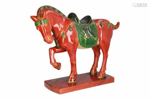 A large polychrome lacquer sculpture, modeled and colored after a Tang-horse. Unmarked. China,