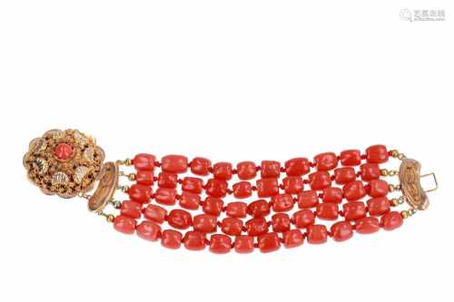 A five-strand red coral bracelet with 14-kt gold clasp set with red coral. Diam ca. 8,3 - 9,0 mm.