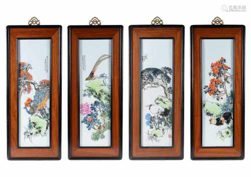 Lot of four polychrome porcelain plaques in wooden frames, depicting a bird, flowers and characters.