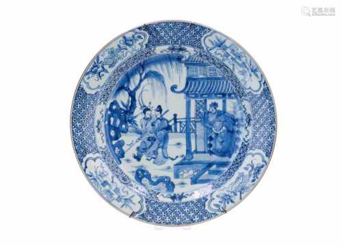 A blue and white porcelain charger, decorated with long Elizas and a dignitary in a garden.