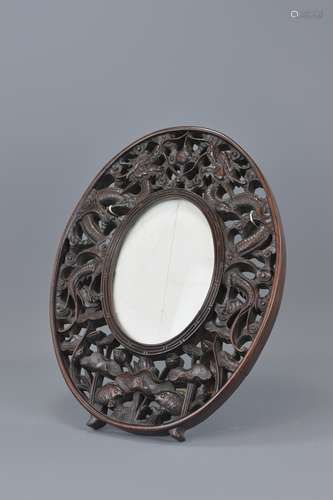 A 19th Century Chinese hardwood frame with stand c