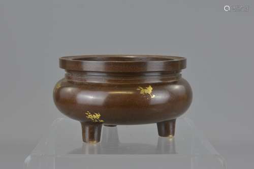 A Chinese 20th century bronze censer on three legs