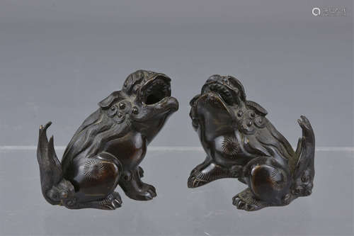 A pair of Chinese 19th century Buddhist Lion dogs.