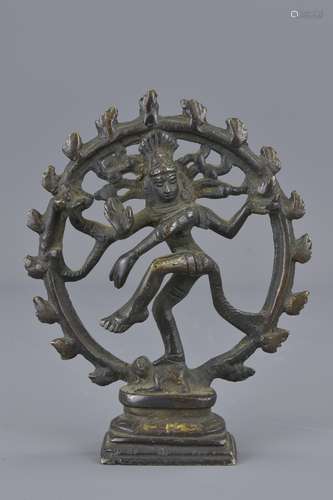 An Indian bronze standing goddess. 10 cm tall.