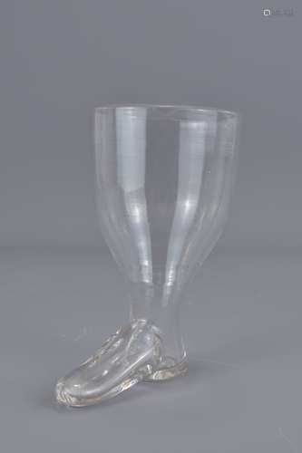 A mid 19th century glass stirrup cup in the form o