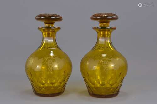 A pair of Amber colour pear shape glass stoppered