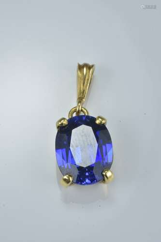 Gold colour pendant with tanzanite stone.