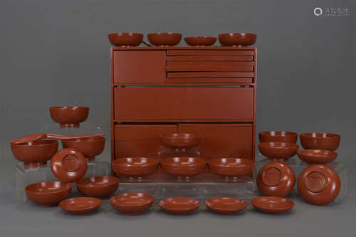 A Japanese lacquer picnic set in wooden carrying b