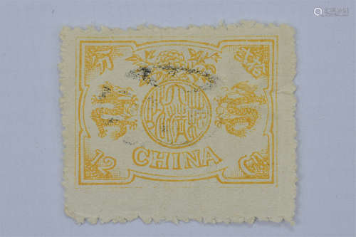 A used mounted 1894-1898 yellow China stamp with Dowager, Dragon and peony design. 12 candarin