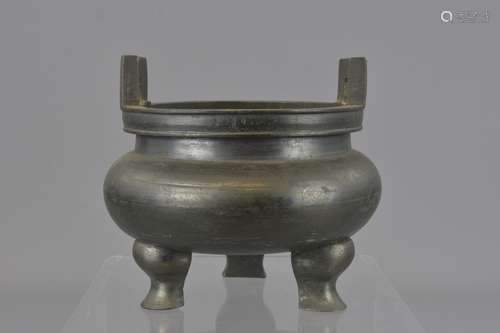 A Chinese 18/19th century bronze censer on a tripo