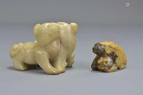 A Chinese jade carving of two dogs conjoined toget