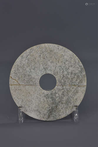 A Chinese Han Dynasty jade disc. 14cm diameter