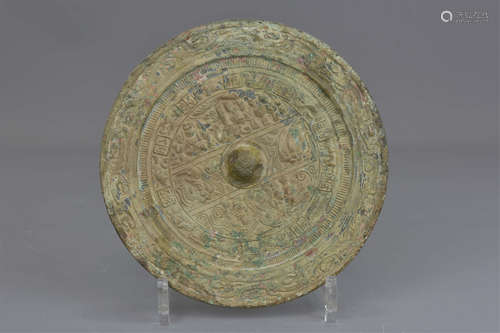 A Chinese Han dynasty bronze mirror with characters. 18cm diameter