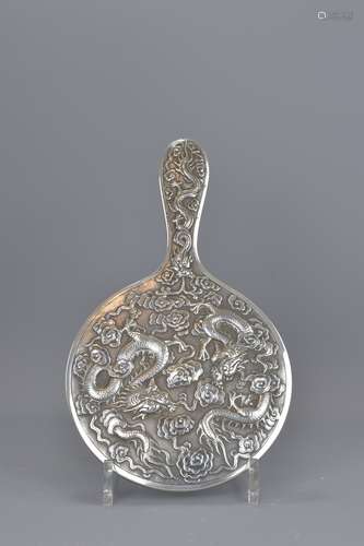 A 19th century Chinese silver mirror with dragon d