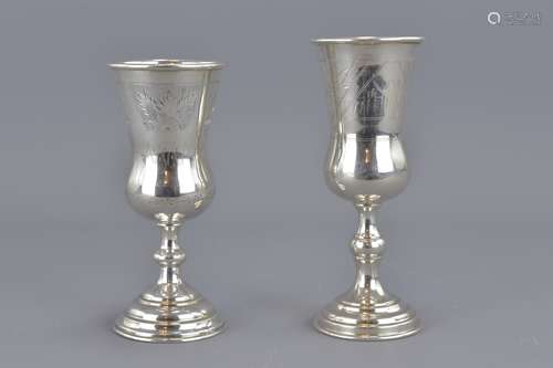 Two Kiddush silver cups one with mark stamped 84.