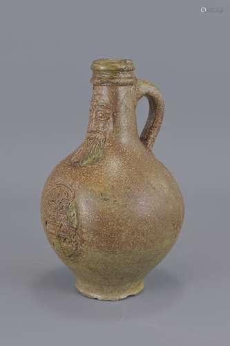 A 17th century stoneware Bellarmine jug with good