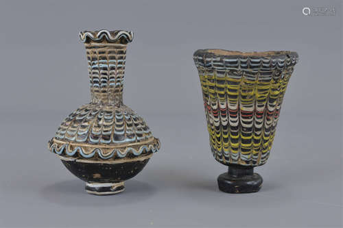 Two Islamic glass vessels 8.5cm height and 10cm he