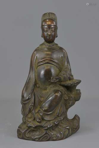 A large Chinese 17/18th century bronze seated figu