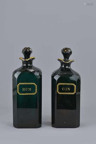 A pair of Emerald green glass gin and rum bottles