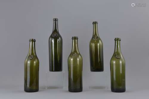 A group of five Victorian green glass wine bottles