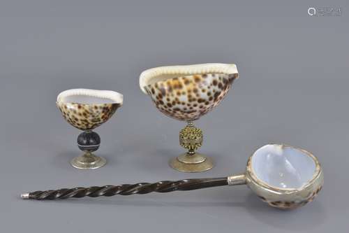 Two shell salts together with one sheel ladle. 9cm