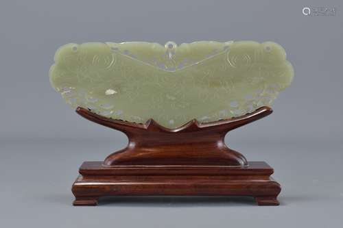 A Chinese carved Celadon Jade plague on wooden sta