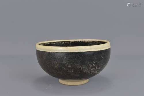 A Chinese Sung/Yuan Dynasty black-glazed bowlDing