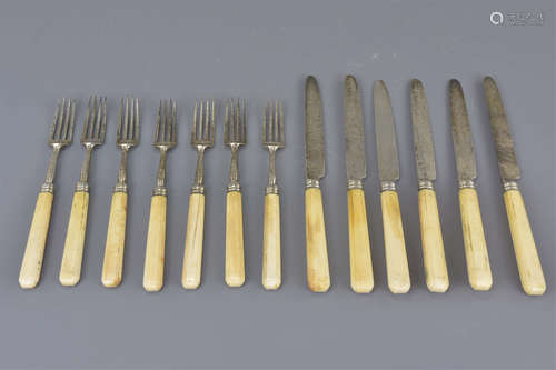 A set of silver knives and forks 20cm length