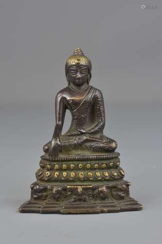 A Tibetan 18/19th century bronze Buddha. 13 cm tal