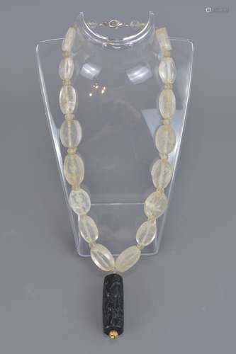 A rock crystal necklace with large roller seal sto