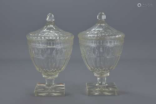 A pair of Victorian cut glass comports and covers