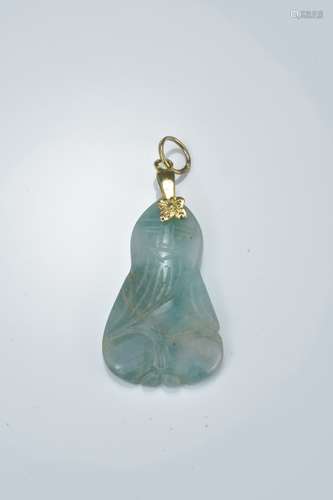 A carved jadeite pendant