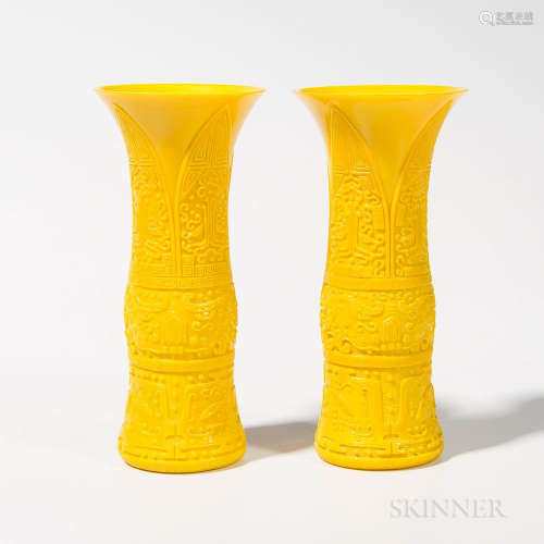 Pair of Yellow Peking Glass Vases, China, gu form, incised with archaic motifs and taotie masks, six-character Qianlong mark in double