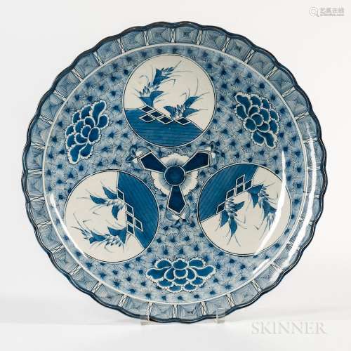 Large Blue and White Charger, Japan, possibly 19th century, with raised floral rim, decorated with stylized plant design in three round